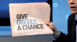 A newspaper with the “Greece is Changing” ad printed.