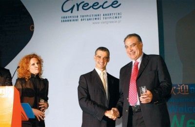 Actress Evelina Papoulia with tourism development minister, Aris Spiliotopoulos and the prefect of Chalkidiki, Asterios Zografos. Chalkidiki received two awards.