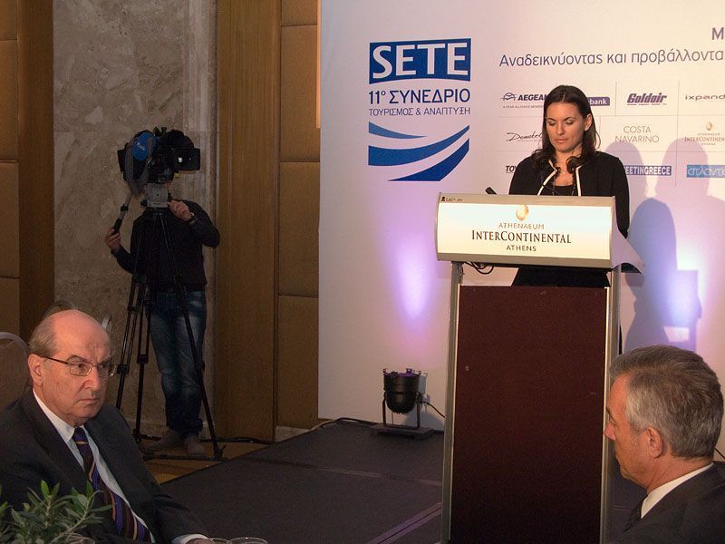 SETE's honorary president, Nikos Aggelopoulos and president, Andreas Andreadis, listening to the keynote speech of Tourism Minister Olga Kefalogianni at the association's conference luncheon.