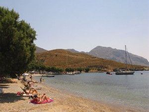 Emborios - A calm beach with crystal clear waters. In ancient times it was an important maritime hub.