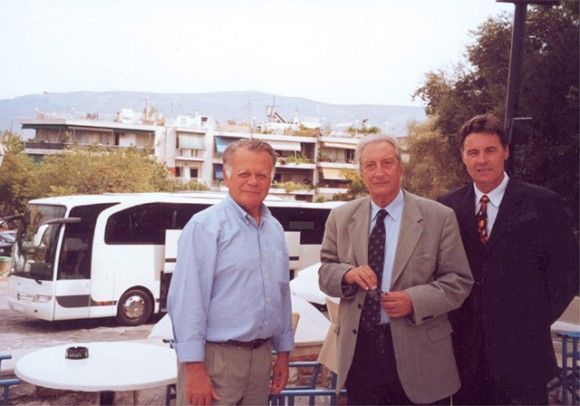 Horst Botz of EvoBus Hellas shows off the newest Mercedes coach to Hellenic Tourism Organization Chairman Yiannis Stefanides and the president of the Hellenic Tourism Coach Owners' Association, Marios Trivizas.