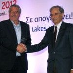Region of Western Macedonia - Regional vice governor Athanasios Kosmatopoulos (left) accepts the award from Tourism Infrastructure and Investment Secretary General Ioannis Pirgiotis.
