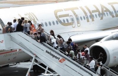 Passengers boarding an Etihad Airways flight.