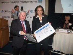 Chandris Hotels President Yiorgos Paidousis receives the Medical Tourism Friendly Hotel (MTFH) certificate from Greek politician Dora Bakogianni.