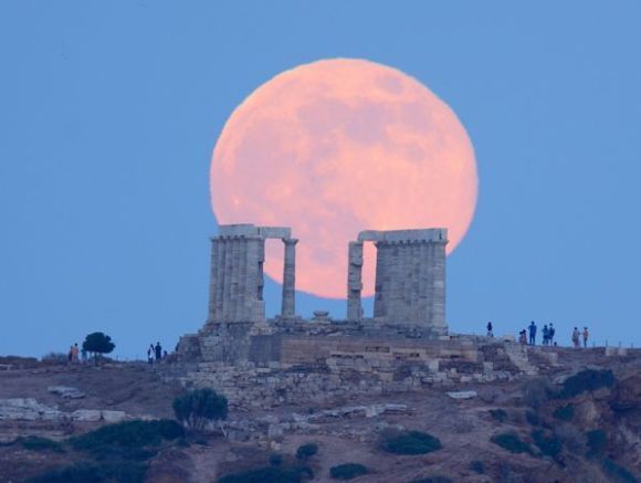 The “supermoon” rising over the ancient temple of Poseidon in Greece on Sunday, 23 June 2013. Photograph by Elias Chasiotis, National Geographic Your Shot.