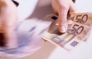Hands counting 50 Euro notes  50 movement blur. Picture: Imagestate