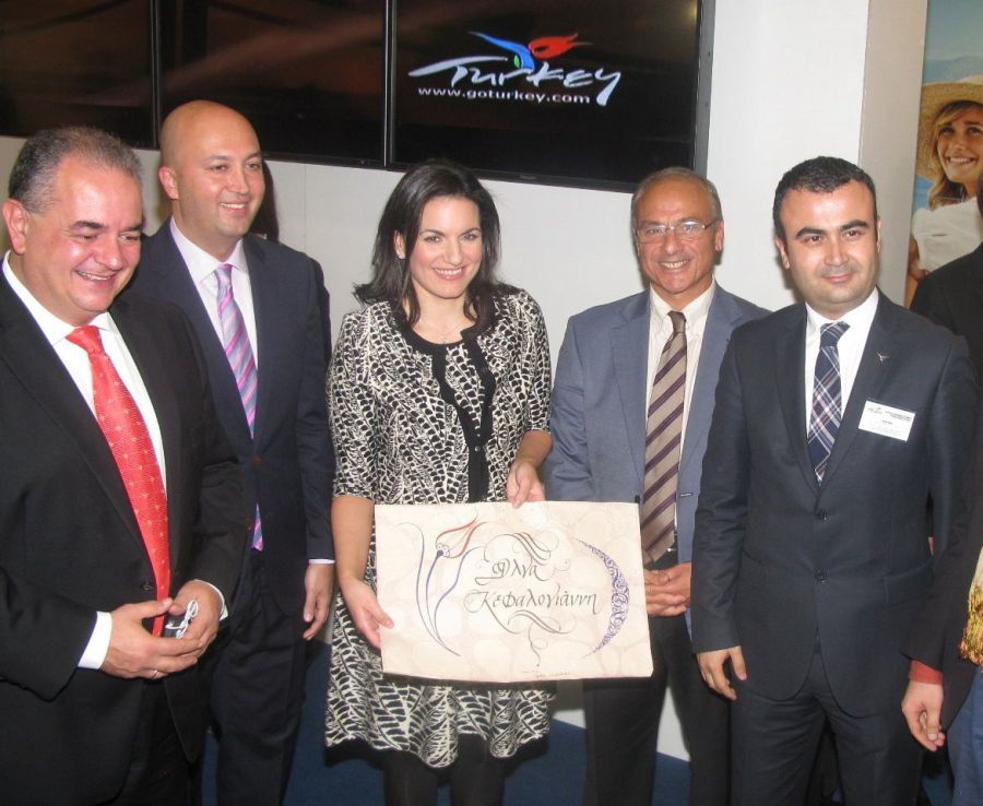 Philoxenia 2013: Greek Tourism Minister Olga Kefalogianni receives a gift at Turkey’s stand..