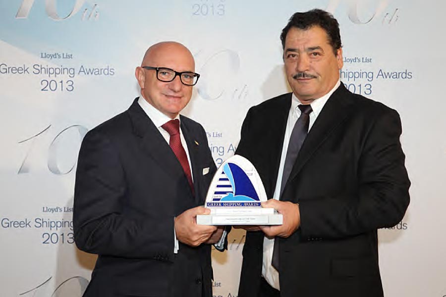 "Passenger Line of the Year Award" - Captain Ioannis Skopelitis of Small Cyclades Lines receives the award from Captain Mauro Renaldi, managing director of V.Ships Greece.