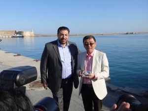 Heraklion Port Authority President Ioannis Bras and the head of the "Rose Wedding" group that traveled to Crete to get married.