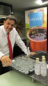 Anastasios Pissas,Trade Co-ordinator, GNTO UK preparing the welcome drink sponsored by the Greek National Tourism Organisation at Symposio's ouzerie event held at the Cheshire Cookery School.