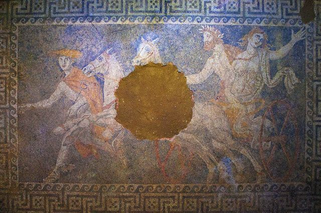 A mosaic of the god Pluto abducting Persephone covers the tomb's second chamber’s floor.