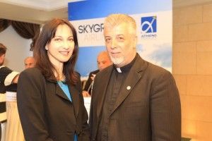 Greek Alternate Tourism Minister Elena Kountoura and Father Nicholas Alexandris, founder and chairman of SkyGreece. "The government supports this great endeavor of SkyGreece Airlines", Ms Kountoura said. In regards to the company's logo, which is the Greek flag on the tail, she stated "this is the best promotion of our country".