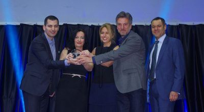 Athens Airport’s communications and marketing director, Ioanna Papadopoulou (second from left), holding the Routes Europe 2016 award.