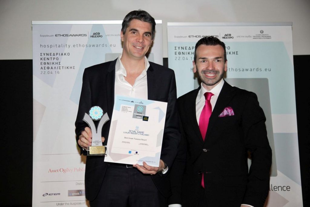 Aldemar's CEO, Alexandros Angelopoulos, with one of Aldemar's eight awards.