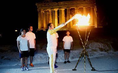 Three times Οlympic winner Pyrros Dimas lights the cauldron with the Olympic Flame in Acropolis of Athens.