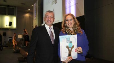 Mideast's managing director, Katerina Mousbeh, holding the Greek Hospitality 2016 