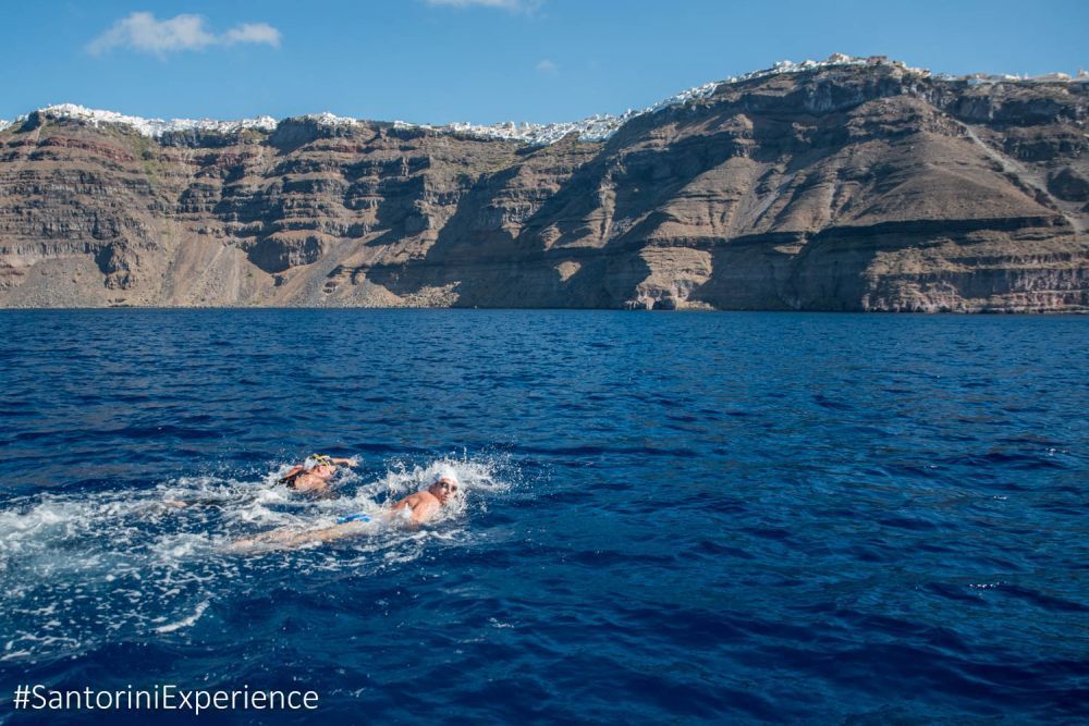 Unique moments from the swimming route of Santorini Experience with a start from the volcano and end at the old port in Fira<br /> Photo © Elias Lefas
