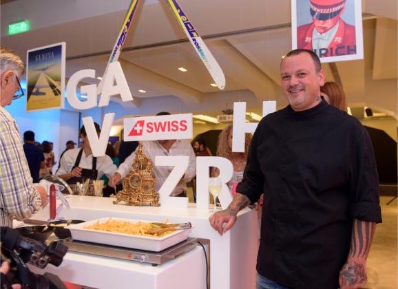 Greek chef Dimitris Skarmoutsos at the booth of the Zurich and Geneva hubs, which served local Swiss cuisine dishes.