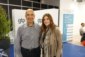 Santorini Hoteliers Association President Manolis Karamolegos with Travelotopos General Manager Maria Aivalioti at GTP's stand at the 100% Hotel Show 2016.