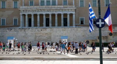 The Greek and French flags outside of the Hellenic Parliament on Thursday.