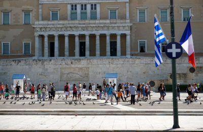 The Greek and French flags outside of the Hellenic Parliament on Thursday.