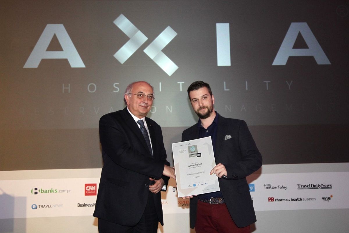 Axia Hospitality founder and CEO received the award from deputy foreign minister Ioannis Amanatidis.