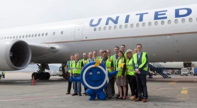 United team and Athens airport mascot, “Philos the Athenian”, in front of the Boeing 767-400ER at Athens International Airport.