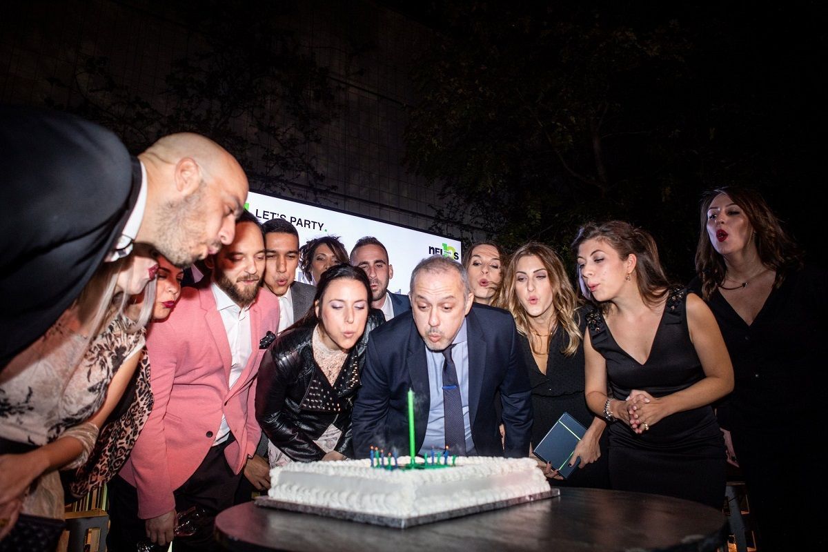 The Nelios team and CEO Dimitris Serifis cut the birthday cake.