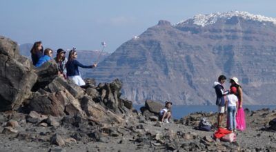 Tourists on Santorini's volcano. Photo © GTP