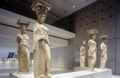 The Caryatids at the Acropolis Museum. Photo Source: Acropolis Museum