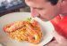 Man eating shrimp spaghetti