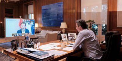 Greek PM Kyriakos Mitsotakis discussing with Austrian Chancellor Sebastian Kurz during a videoconference held between world leaders on April 24. Photo source: primeminister.gr