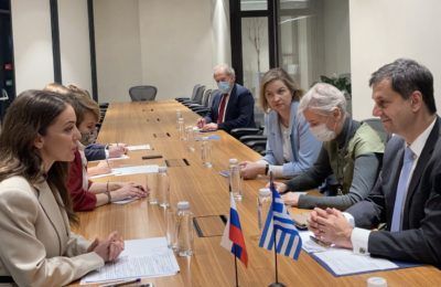 Greek Tourism Minister Harry Theoharis in discussion with the head of Russia's Federal Agency for Tourism, Zarina Valerievna Doguzova.