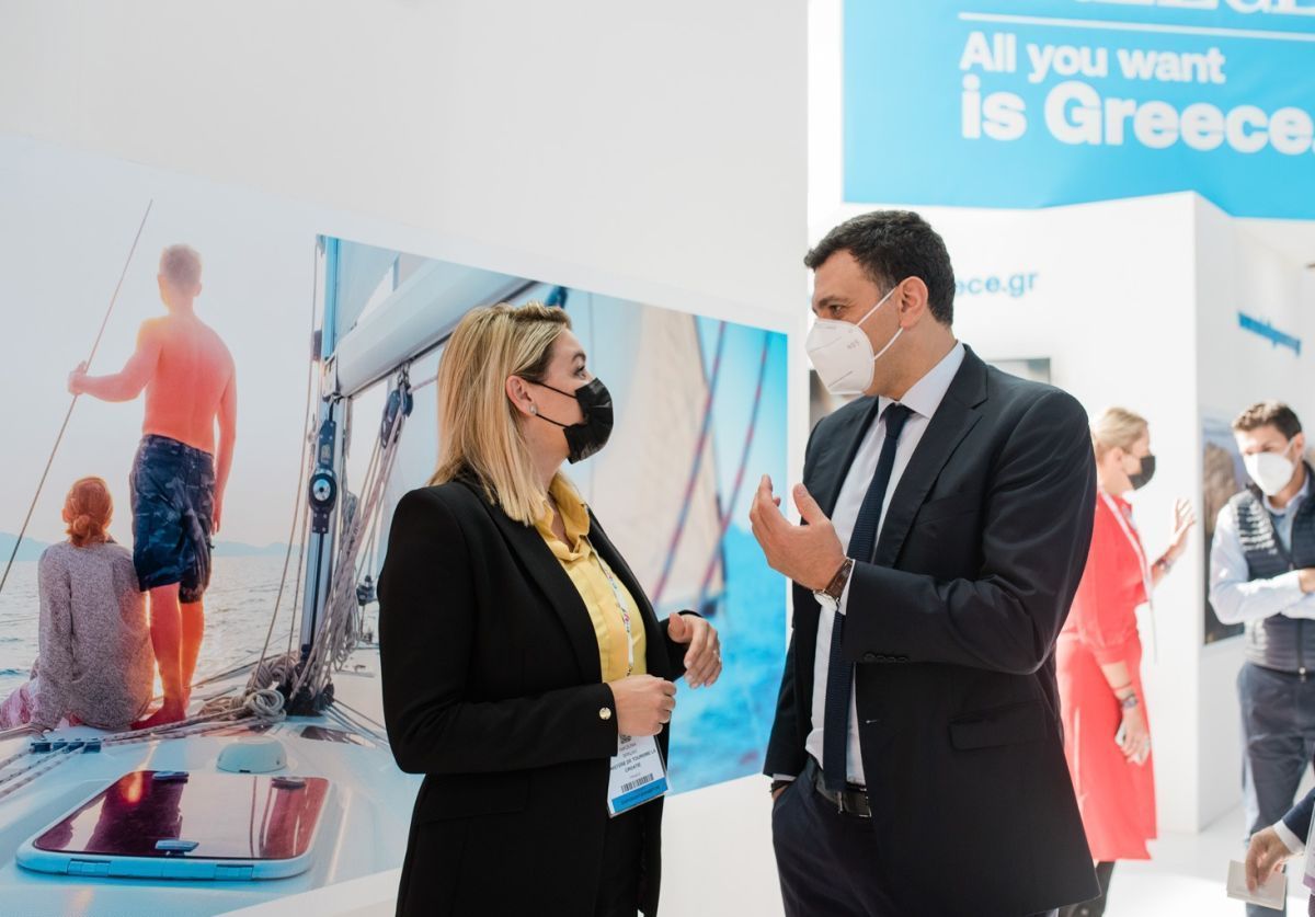 Greek Tourism Minister Vassilis Kikilias in conversation with Croatia's tourism minister, Nikolina Brnjac, at the Greek stand during the IFTM Top Resa expo.