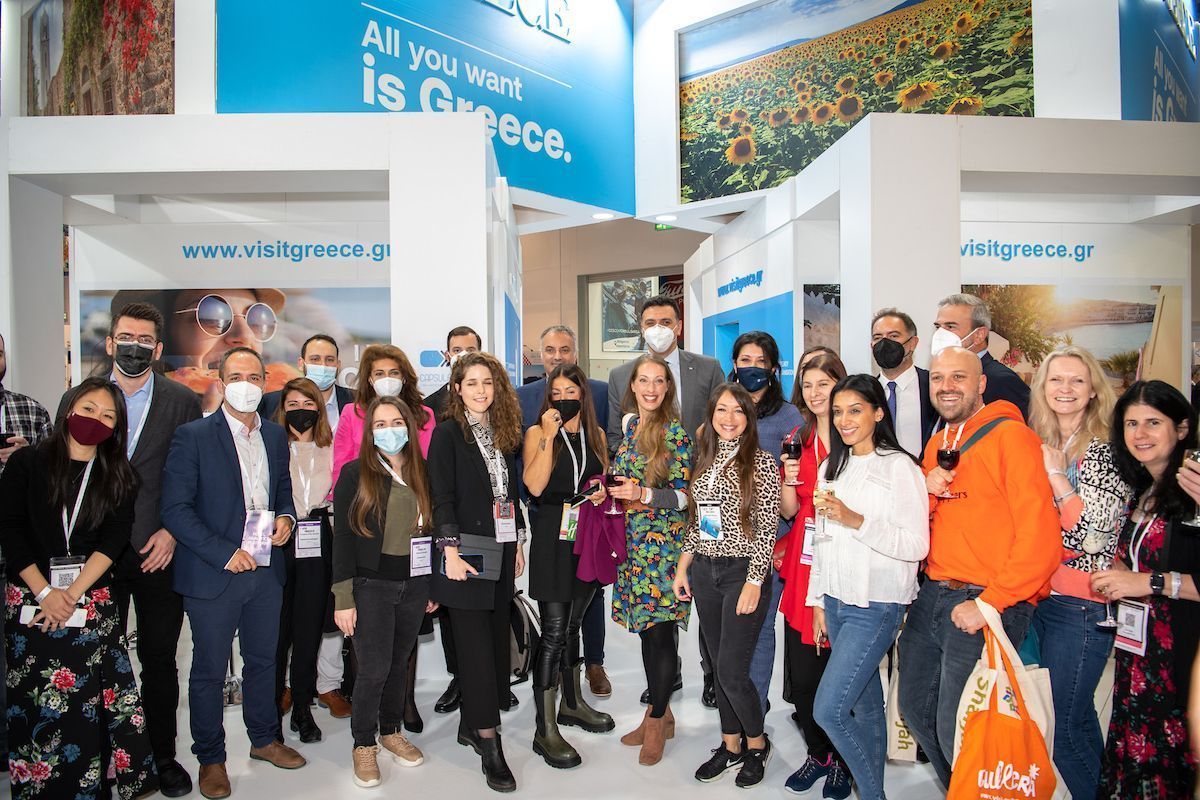 Greek Tourism Minister Vassilis Kikilias with travel bloggers at the Visit Greece stand.