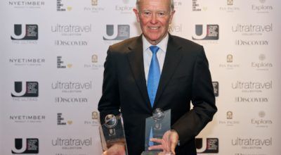 Emirates Airline President Sir Tim Clark accepts two ULTRAs at 2022 awards ceremony.