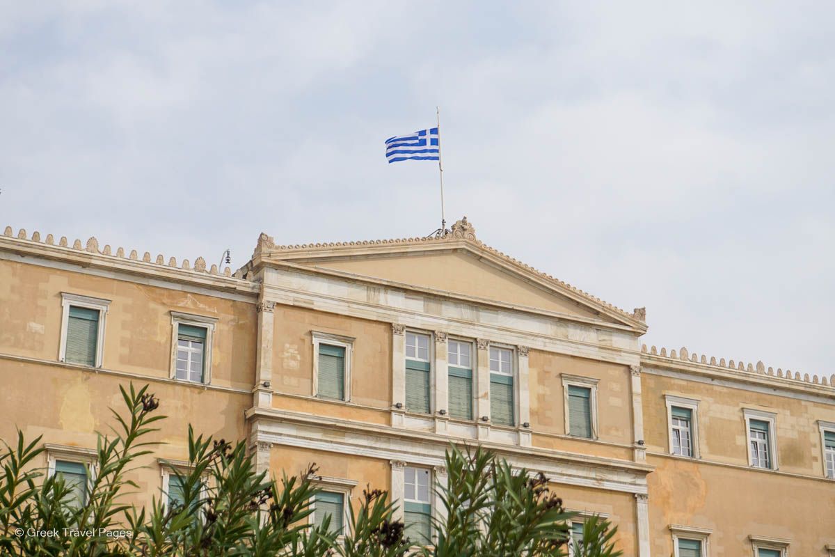 The Greek flag on the Hellenic Parliament waving at half-mast in sign of mourning of the lives lost in the fatal train crash in Tempi, Central Greece, on late Tuesday.