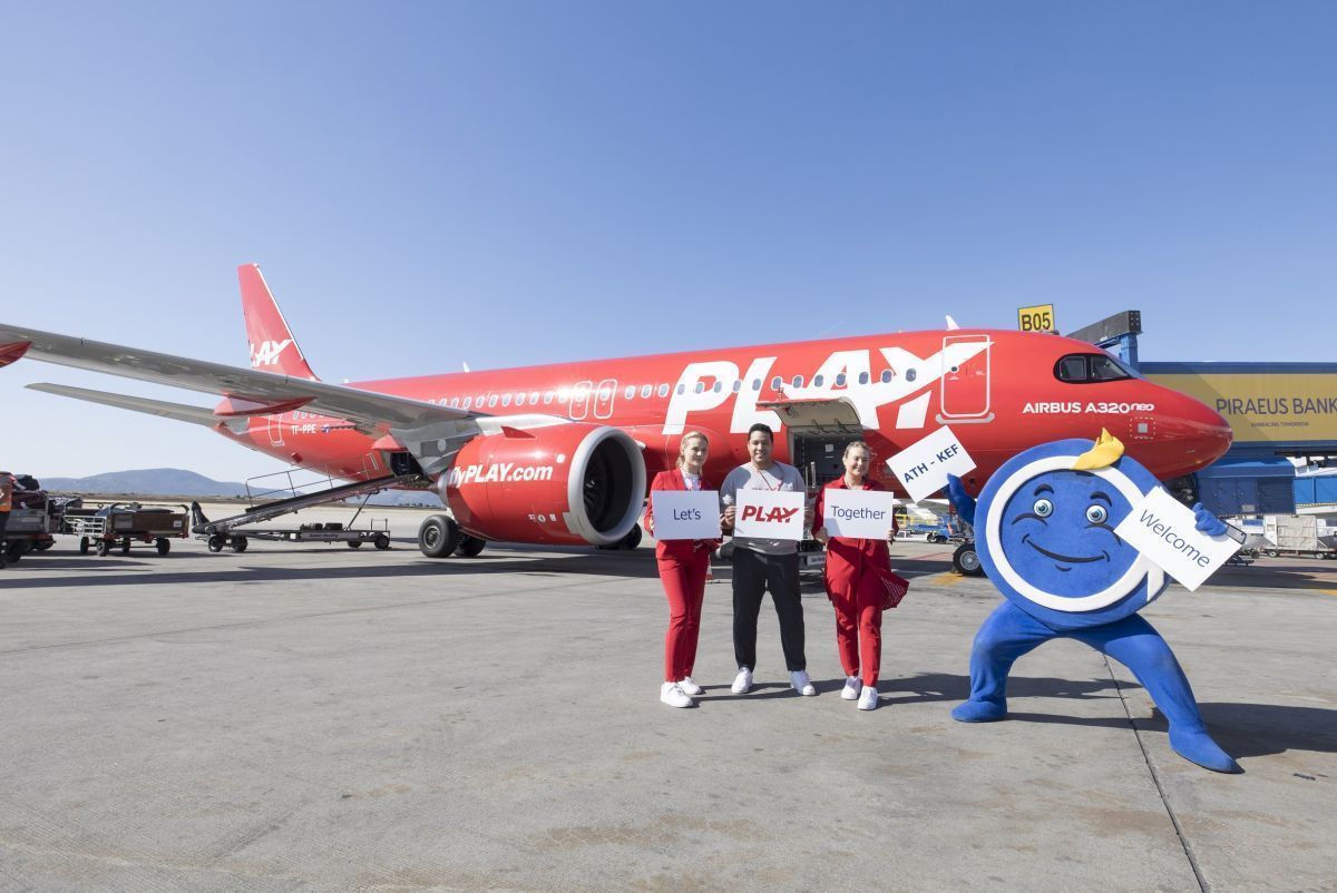Members of PLAY's cabin crew with AIA's mascot Filos the Athenian. Photo source: PLAY