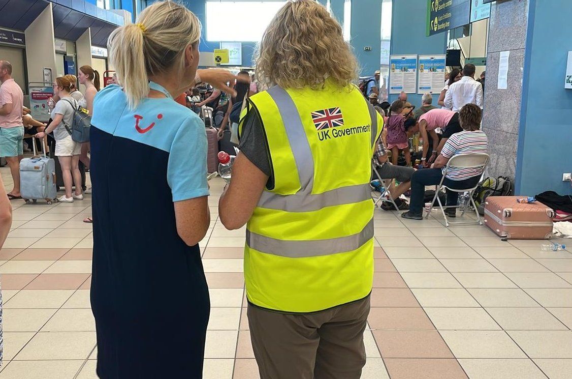 Rhodes Airport: A TUI representative speaking with a member of the UK government's Rapid Deployment Team that arrived on the island to support British nationals. Photo source: Foreign, Commonwealth & Development Office