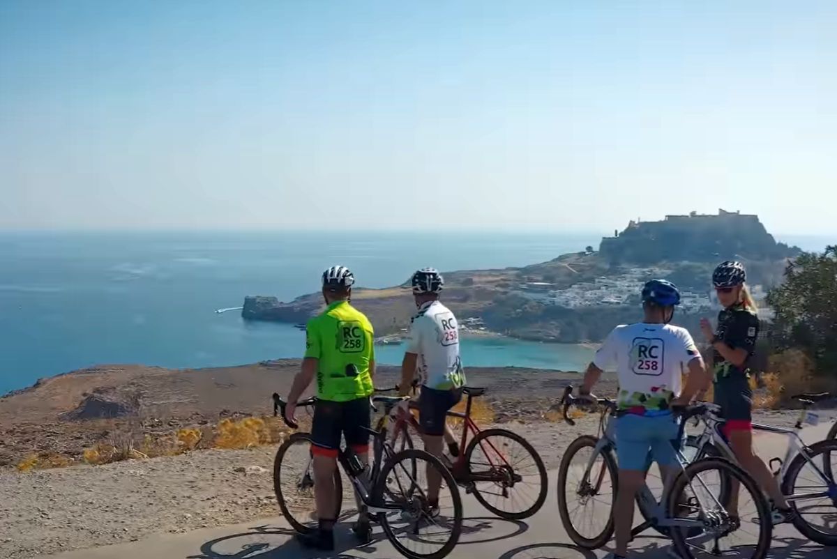 Cyclists looking towards Lindos, Rhodes. Photo source: Visit Greece