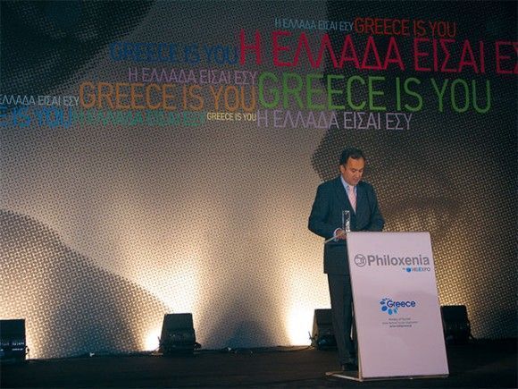 Aristotelis Thomopoulos, president of Helexpo, inaugurates the 24th Philoxenia tourism exhibition. During his speech, he underlined the fact that this year's exhibition is improved and more commercial given the participation of 25 foreign countries, the high attendance of tourism agencies and the strong presence of the hotel equipment exhibition Hotelia and the Philoxenia Spa Expo. In the background is the proposed new slogan for Greece’s new promotional campaign: “Greece is You.”