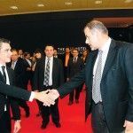 Tourism Minister Aris Spiliotopoulos greets Greek Travel Pages' sales and advertising manager, Thanassis Cavdas, at the GTP stand.