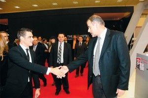 Tourism Minister Aris Spiliotopoulos greets Greek Travel Pages' sales and advertising manager, Thanassis Cavdas, at the GTP stand.