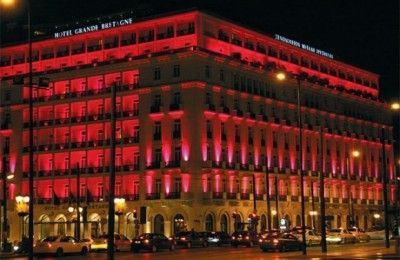Grande Bretagne Hotel in pink light, as part of the Estee Lauder campaign for breast cancer.