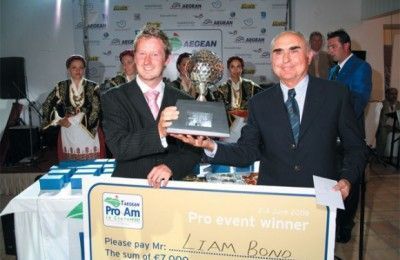 Great Britain's Liam Bond accepting the prize for first place from Theodoros Vasilakis, president and managing director of Aegean Airlines.