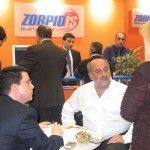 The Zorpidis Tourism Organization stand was without a doubt the busiest professional stand within the fair. Here, Michalis Zorpidis (center) stickhandles clients, customers and staff as he did throughout the four days of the fair.