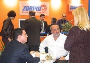 The Zorpidis Tourism Organization stand was without a doubt the busiest professional stand within the fair. Here, Michalis Zorpidis (center) stickhandles clients, customers and staff as he did throughout the four days of the fair.