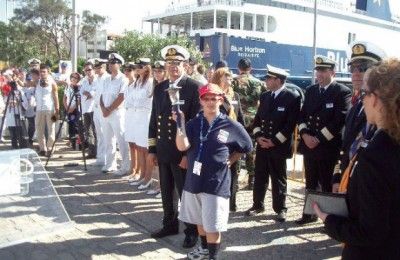 Captain Charalambos Tsimaras and the torchbearer with the Blue Horizon crew before sailing to Italy.
