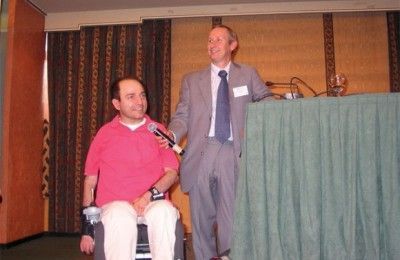 Nikos Voulgaropoulos of Disability Now, Greece, with Ivor Ambrose, OSSATE's coordinator for EWORX Greece, during the former's speech on the development of One-stop-shop for Accessible Tourism in Europe.