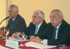 Vassilis Minaidis, president of the Panhellenic Hoteliers' Federation; board member Spyros Divanis; and secretary general of the federation, Gerasimos Kalligeros.